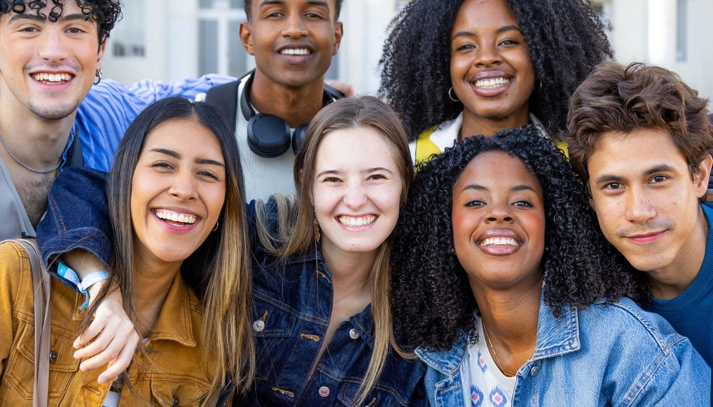 Diverse students together on a school campus